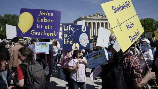 Participants in the 'March for Life' rally stand with banners reading 'Every life is a gift', 'Life is life' and 'Euthanasia no thanks' in Munich, Germany, Saturday, April 13, 2024. An independent experts commission has recommended that abortion in Germany should no longer fall under the country’s penal code and be made legal during the first 12 weeks of pregnancy. Currently, abortion is considered illegal in Germany, but not punishable if a woman undergoes mandatory counseling and a three-day wait period before she has the procedure. (Uwe Lein/dpa via AP) Participants in the 'March for Life' rally stand with banners reading 'Every life is a gift', 'Life is life' and 'Euthanasia no thanks' in Munich, Germany, Saturday, April 13, 2024. An independent experts commission has recommended that abortion in Germany should no longer fall under the country’s penal code and be made legal during the first 12 weeks of pregnancy. Currently, abortion is considered illegal in Germany, but not punishable if a woman undergoes mandatory counseling and a three-day wait period before she has the procedure. (Uwe Lein/dpa via AP)