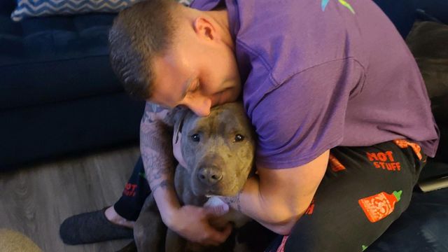 Fort Bragg specialist adopts, embraces dog with missing ear from SPCA of Wake County