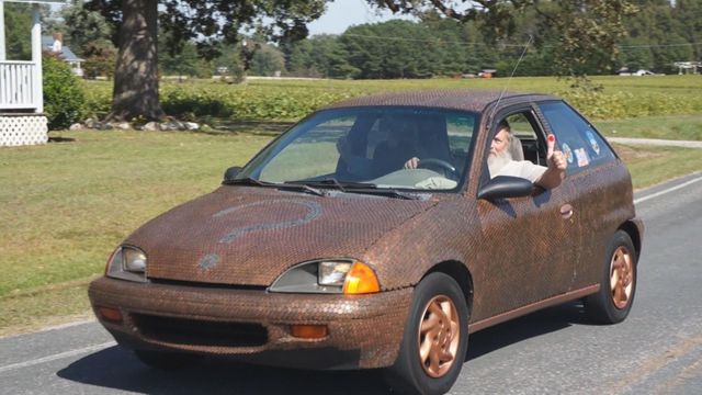 Wendell man glues over 28,000 pennies to his car
