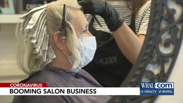 Sam and Bill's salon greets customer deluge with a smile behind the mask