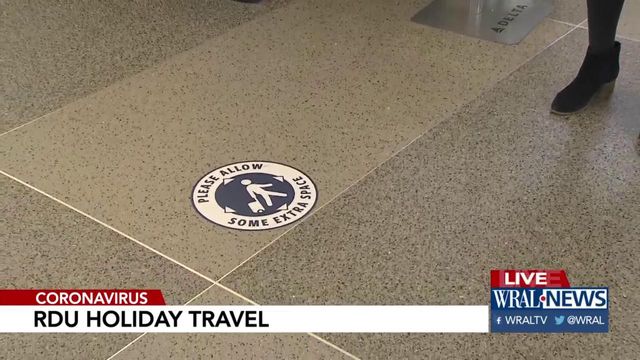 Sanitizer, plexiglass greet smaller number of Thanksgiving travelers at RDU