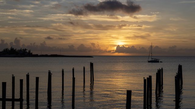 Sunset in Eleuthera, the Bahamas, in December 2023. The narrow Bahamian island boasts miles of mostly empty beaches, walking trails, turquoise ocean waters and other natural wonders, with no major resorts or high-end shopping. (Scott Baker/The New York Times)