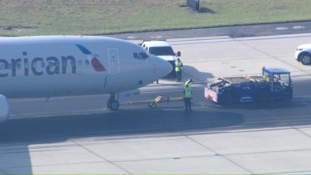 Crews towing plane off runway after American Airlines flight makes emergency landing at RDU Thursday morning