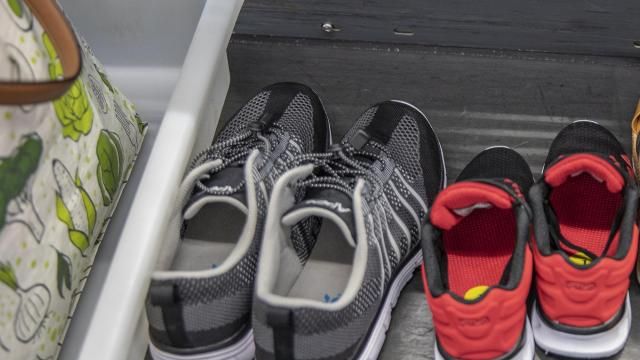 FILE — Shoes at a TSA checkpoint at John F. Kennedy International Airport in New York, Aug. 19, 2021. For the first time in nearly 20 years, the Transportation Security Administration is letting people keep their shoes on. (Tony Cenicola/The New York Times)