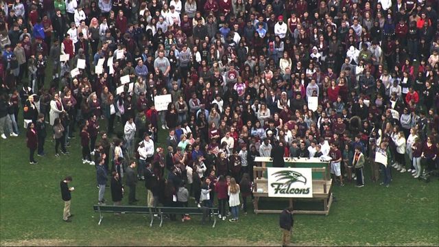 Sky 5 flies over Green Hope High School as students walk out of class in protest