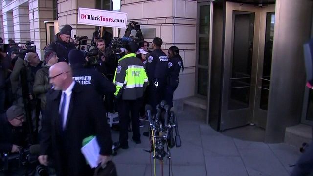 People, reporters wait for Michael Flynn outside courthouse