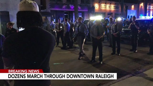 Police move protesters off road as march continues after Raleigh officer-involved shooting