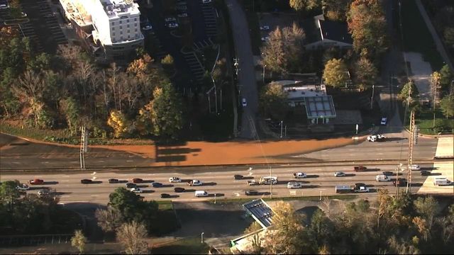 Sky 5: Muddy water covers Glenwood Avenue near Crabtree Valley Mall