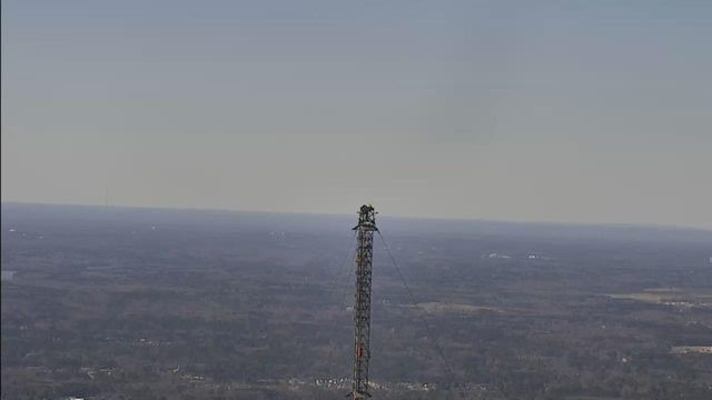 Engineers work in clouds on WRAL tower