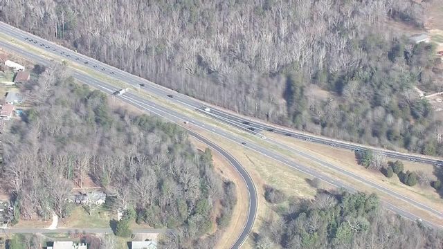 Procession of law enforcement officers carries body of western NC trooper to funeral 
