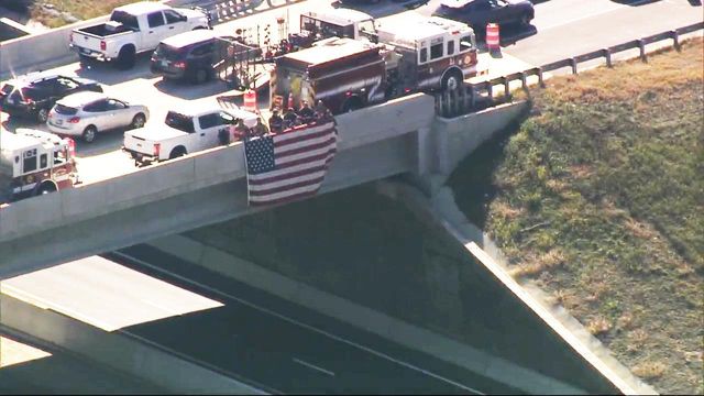 Sky 5 flies over procession for Raleigh fire captain