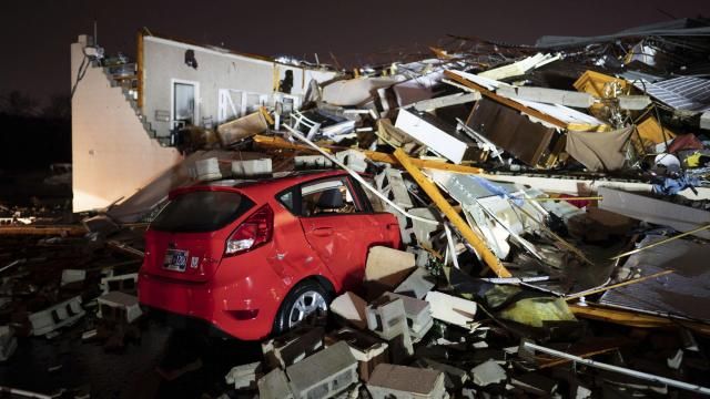 A car is buried under rubble on Main Street after a tornado hit Hendersonville, Tenn., Saturday, Dec. 9, 2023. (Andrew Nelles/The Tennessean via AP)