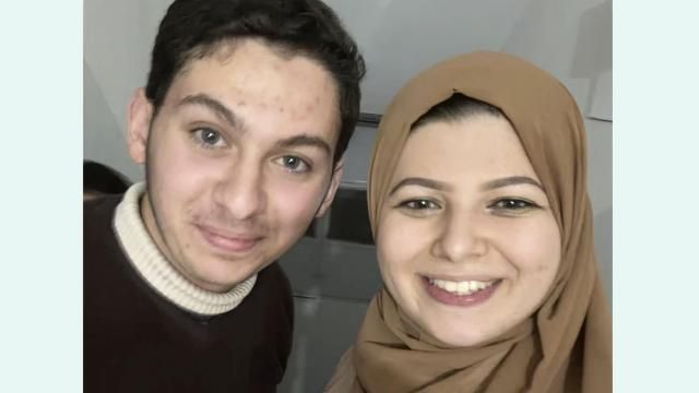 This undated image provided by Yasmeen Elagha shows Elagha, right, with her cousin Borak Alagha. Relatives of Borak Alagha, 28, and Hashem Alagha, 20, two American brothers trapped in Gaza, say Israeli forces have detained the two U.S. citizens, along with their Canadian father, in a raid on their home early Thursday, Feb. 8, 2024. (Yasmeen Elagha via AP) This undated image provided by Yasmeen Elagha shows Elagha, right, with her cousin Borak Alagha. Relatives of Borak Alagha, 28, and Hashem Alagha, 20, two American brothers trapped in Gaza, say Israeli forces have detained the two U.S. citizens, along with their Canadian father, in a raid on their home early Thursday, Feb. 8, 2024. (Yasmeen Elagha via AP)