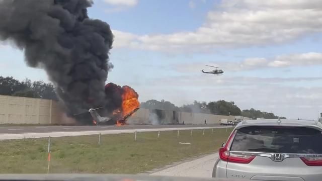 Smoke and fire fills the air after an airplane crashed on Interstate 75, Friday, Feb. 10, 2024 near Naples, Fla. Federal authorities have launched an investigation to determine why the private jet tried to make an emergency landing on the Florida interstate, colliding with a vehicle and sparking a fiery crash that left two people dead. (Chris O'Conner via AP) Smoke and fire fills the air after an airplane crashed on Interstate 75, Friday, Feb. 10, 2024 near Naples, Fla. Federal authorities have launched an investigation to determine why the private jet tried to make an emergency landing on the Florida interstate, colliding with a vehicle and sparking a fiery crash that left two people dead. (Chris O'Conner via AP)