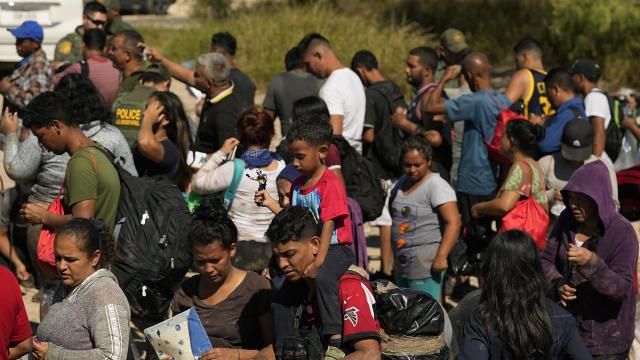 FILE - Migrants wait to be processed by the U.S. Customs and Border Patrol after they crossed the Rio Grande and entered the U.S. from Mexico, Oct. 19, 2023, in Eagle Pass, Texas. A recent decline in arrests for illegal crossings on the U.S. border with Mexico may prove only temporary. The drop in January reflects how numbers ebb and flow, and the reason usually goes beyond any single factor. (AP Photo/Eric Gay, FILE) FILE - Migrants wait to be processed by the U.S. Customs and Border Patrol after they crossed the Rio Grande and entered the U.S. from Mexico, Oct. 19, 2023, in Eagle Pass, Texas. A recent decline in arrests for illegal crossings on the U.S. border with Mexico may prove only temporary. The drop in January reflects how numbers ebb and flow, and the reason usually goes beyond any single factor. (AP Photo/Eric Gay, FILE)