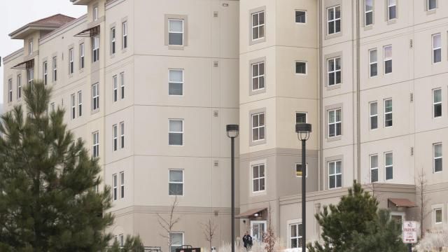 A police officer stands outside a dorm in the Village at Alpine Valley housing, Friday, Feb. 16, 2024, as police investigate a shooting on the University of Colorado Colorado Springs campus in Colorado Springs, Colo. (Christian Murdock/The Gazette via AP) A police officer stands outside a dorm in the Village at Alpine Valley housing, Friday, Feb. 16, 2024, as police investigate a shooting on the University of Colorado Colorado Springs campus in Colorado Springs, Colo. (Christian Murdock/The Gazette via AP)