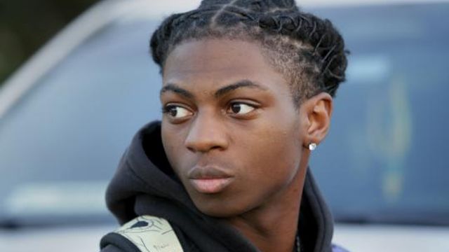 FILE - Darryl George, a 17-year-old junior, before walking across the street to go into Barbers Hill High School after serving a 5-day in-school suspension for not cutting his hair, Sept. 18, 2023, in Mont Belvieu, Texas. A trial is set to be held Thursday, Feb. 21, 2024, to determine if George can continue being punished by his district for refusing to change his hairstyle, which he and his family say is protected by a new state law that prohibits race-based hair discrimination. (AP Photo/Michael Wyke, File) FILE - Darryl George, a 17-year-old junior, before walking across the street to go into Barbers Hill High School after serving a 5-day in-school suspension for not cutting his hair, Sept. 18, 2023, in Mont Belvieu, Texas. A trial is set to be held Thursday, Feb. 21, 2024, to determine if George can continue being punished by his district for refusing to change his hairstyle, which he and his family say is protected by a new state law that prohibits race-based hair discrimination. (AP Photo/Michael Wyke, File)