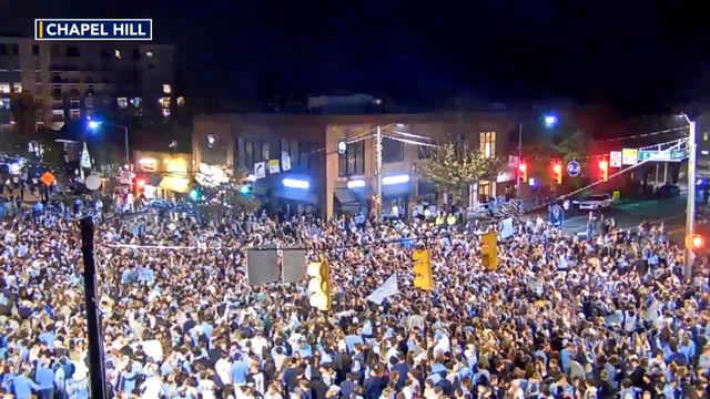 UNC fans rush Franklin Street in Chapel Hill after beating Duke