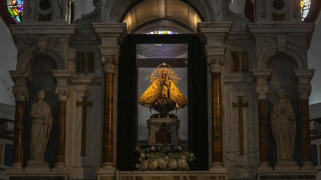 The original statue of the Virgin of Charity of El Cobre stands behind the altar at her shrine in El Cobre, Cuba, Sunday, Feb. 11, 2024. The Vatican-recognized Virgin, venerated by Catholics and followers of Afro-Cuban Santeria traditions, is at the heart of Cuban identity, uniting compatriots from the Communist-run Caribbean island to those who were exiled or emigrated to the U.S. (AP Photo/Ramon Espinosa) The original statue of the Virgin of Charity of El Cobre stands behind the altar at her shrine in El Cobre, Cuba, Sunday, Feb. 11, 2024. The Vatican-recognized Virgin, venerated by Catholics and followers of Afro-Cuban Santeria traditions, is at the heart of Cuban identity, uniting compatriots from the Communist-run Caribbean island to those who were exiled or emigrated to the U.S. (AP Photo/Ramon Espinosa)
