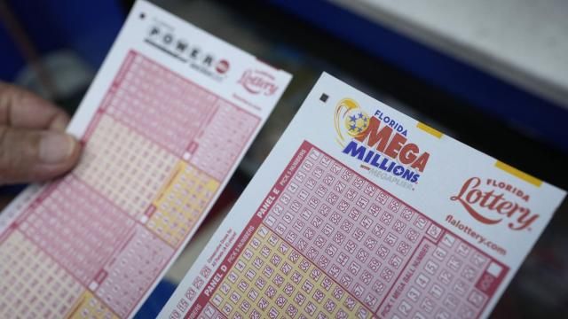 FILE - A lottery player holds forms to pick numbers for the Powerball and Mega Millions lotteries as he buys tickets, Monday, Aug. 7, 2023, at the Presidente Supermarket in the Little Havana neighborhood of Miami. The Mega Millions jackpot is already estimated at a whopping $875 million for Tuesday night's drawing after no tickets matched all six numbers drawn on Friday night., March 15, 2024. (AP Photo/Wilfredo Lee, File) FILE - A lottery player holds forms to pick numbers for the Powerball and Mega Millions lotteries as he buys tickets, Monday, Aug. 7, 2023, at the Presidente Supermarket in the Little Havana neighborhood of Miami. The Mega Millions jackpot is already estimated at a whopping $875 million for Tuesday night's drawing after no tickets matched all six numbers drawn on Friday night., March 15, 2024. (AP Photo/Wilfredo Lee, File)
