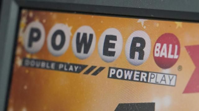 FILE - A display panel advertises tickets for a Powerball drawing at a convenience store, Nov. 7, 2022, in Renfrew, Pa. The Mega Millions jackpot is already estimated at a whopping $875 million for Tuesday night's drawing after no tickets matched all six numbers drawn on Friday night, March 15, 2024. (AP Photo/Keith Srakocic, File) FILE - A display panel advertises tickets for a Powerball drawing at a convenience store, Nov. 7, 2022, in Renfrew, Pa. The Mega Millions jackpot is already estimated at a whopping $875 million for Tuesday night's drawing after no tickets matched all six numbers drawn on Friday night, March 15, 2024. (AP Photo/Keith Srakocic, File)