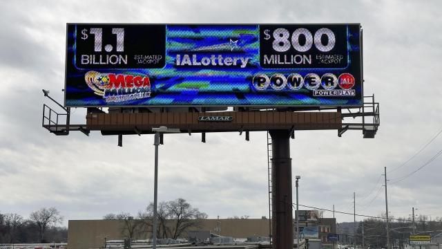 An electronic billboard advertises the Mega Millions and Powerball jackpots, Monday, March 25, 2024, in in Des Moines, Iowa, that when combined amount to nearly $2 billion. It's the first time the two lottery games each have jackpots of $800 million or more. (AP Photo/Scott McFetridge) An electronic billboard advertises the Mega Millions and Powerball jackpots, Monday, March 25, 2024, in in Des Moines, Iowa, that when combined amount to nearly $2 billion. It's the first time the two lottery games each have jackpots of $800 million or more. (AP Photo/Scott McFetridge)