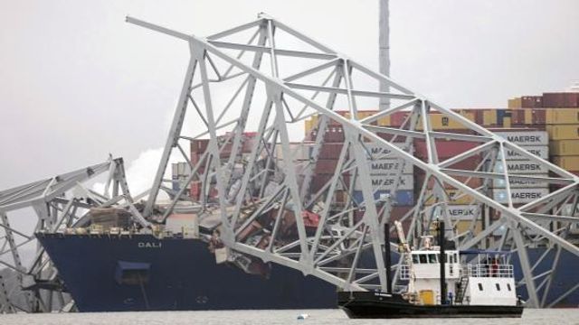 A cargo ship is stuck under the part of the structure of the Francis Scott Key Bridge after the ship hit the bridge Wednesday, March 27, 2024, in Baltimore, Md. (AP Photo/Steve Helber) A cargo ship is stuck under the part of the structure of the Francis Scott Key Bridge after the ship hit the bridge Wednesday, March 27, 2024, in Baltimore, Md. (AP Photo/Steve Helber)