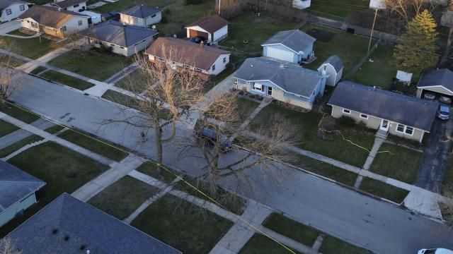 Police tape surrounds many homes as police investigate a mass stabbing along the 2300 block of Holmes Street on March 27, 2024, in Rockford, Ill. (Stacey Wescott/Chicago Tribune via AP) Police tape surrounds many homes as police investigate a mass stabbing along the 2300 block of Holmes Street on March 27, 2024, in Rockford, Ill. (Stacey Wescott/Chicago Tribune via AP)