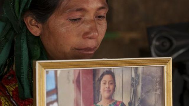 Olivia Orozco Lopez cries as she holds a portrait of her late daughter Celestina Carolina during an interview in the Culvilla hamlet of Tejutla, Guatemala, Tuesday, March 19, 2024. Carolina died asphyxiated alongside 50 other migrants in a smuggler's trailer truck in San Antonio, Texas in June 2022. (AP Photo/Moises Castillo) Olivia Orozco Lopez cries as she holds a portrait of her late daughter Celestina Carolina during an interview in the Culvilla hamlet of Tejutla, Guatemala, Tuesday, March 19, 2024. Carolina died asphyxiated alongside 50 other migrants in a smuggler's trailer truck in San Antonio, Texas in June 2022. (AP Photo/Moises Castillo)