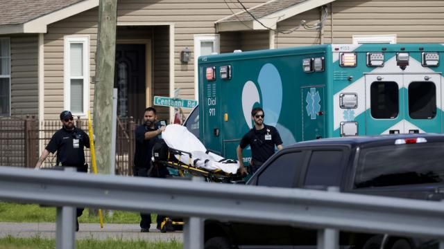 First responders work the scene after three Louisiana police officers were shot in a standoff Sunday, April 28, 2024, in Kenner, La. (Scott Threlkeld/The Times-Picayune/The New Orleans Advocate via AP)