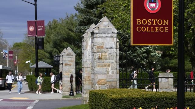Students walk on the campus of Boston College, Monday, April 29, 2024, in Boston. While many colleges and universities in the Boston area have been scenes of encampments and arrests, Boston College has been relatively quiet. (AP Photo/Charles Krupa)