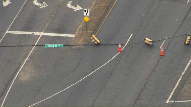 Car brings down traffic light at US 70 and Timber Drive Car brings down traffic light at US 70 and Timber Drive
