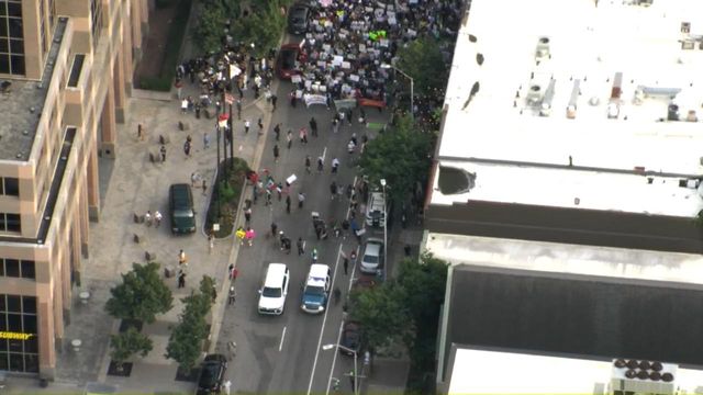 Protesters march in downtown Raleigh against President Trump's immigration policies