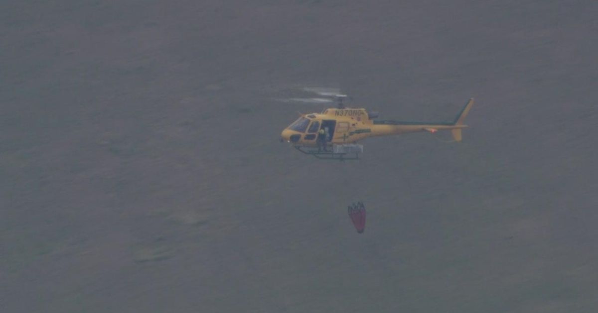 Firefighters battle large outdoor fire in Moore County