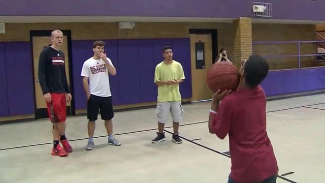 Wolfpack players brighten day for Broughton students
