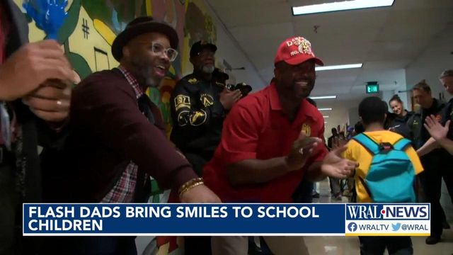'Flash dads' bring smiles to Louisville school children