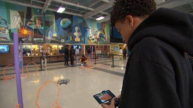 Students learning basics of flying drones in preparation for FAA test