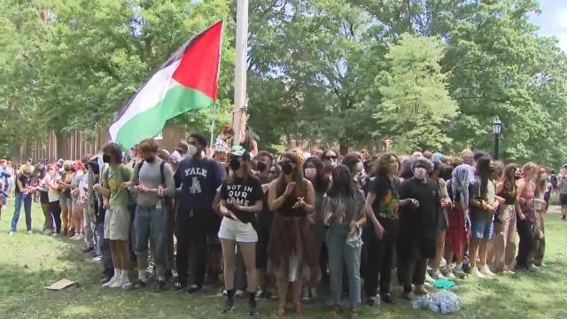 A Palestinian flag goes up at UNC's main quad on April 30, 2024.