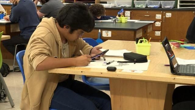 Enloe Magnet High School student uses cellphone for coursework
