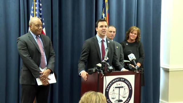State Superintendent of Public Instruction Mo Green (left) and North Carolina Attorney General Jeff Jackson (at the podium) announced a lawsuit against the Trump administration for its latest withholding of more than $180 million in education funds intended for nearly all of the state's school systems and charter schools and dozens of nonprofits.
