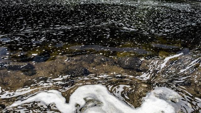 FILE - PFAS foam gathers at the the Van Etten Creek dam in Oscoda Township, Mich., near Wurtsmith Air Force Base, June 7, 2018. The Wisconsin Assembly passed a bill Thursday, Feb. 22, 2024, that would unlock $125 million to help municipalities and landowners cope with pollution from so-called forever chemicals, but Gov. Tony Evers isn't on board. (Jake May/The Flint Journal via AP, File) FILE - PFAS foam gathers at the the Van Etten Creek dam in Oscoda Township, Mich., near Wurtsmith Air Force Base, June 7, 2018. The Wisconsin Assembly passed a bill Thursday, Feb. 22, 2024, that would unlock $125 million to help municipalities and landowners cope with pollution from so-called forever chemicals, but Gov. Tony Evers isn't on board. (Jake May/The Flint Journal via AP, File)