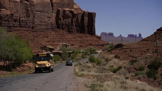FILE - A school bus moves up Rock Door Canyon Rd., in Oljato-Monument Valley, Utah, on the Navajo reservation, April 27, 2020. The U.S. Federal Energy Regulatory Commission has rejected several proposed hydropower projects on the largest Native American reservation in the U.S. The commission has also created a policy that essentially gives tribes veto power over such projects early on. (AP Photo/Carolyn Kaster, File) FILE - A school bus moves up Rock Door Canyon Rd., in Oljato-Monument Valley, Utah, on the Navajo reservation, April 27, 2020. The U.S. Federal Energy Regulatory Commission has rejected several proposed hydropower projects on the largest Native American reservation in the U.S. The commission has also created a policy that essentially gives tribes veto power over such projects early on. (AP Photo/Carolyn Kaster, File)