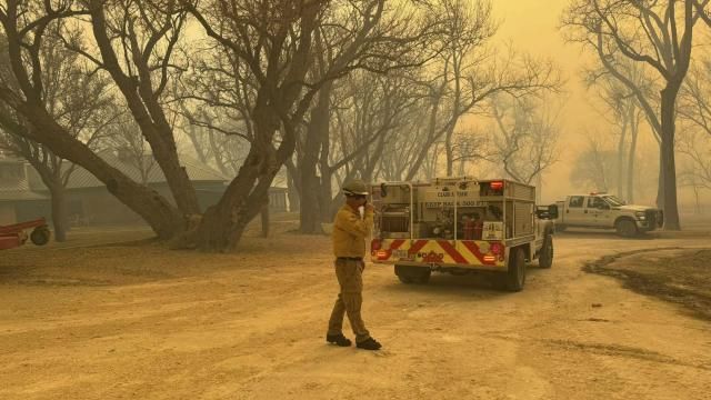 In this photo provided by the Flower Mound, Texas, Fire Department, Flower Mound firefighters respond to a fire in the Texas Panhandle, Tuesday, Feb. 27, 2024. A rapidly widening Texas wildfire doubled in size Tuesday and prompted evacuation orders in at least one small town. (Flower Mound Fire Department via AP) In this photo provided by the Flower Mound, Texas, Fire Department, Flower Mound firefighters respond to a fire in the Texas Panhandle, Tuesday, Feb. 27, 2024. A rapidly widening Texas wildfire doubled in size Tuesday and prompted evacuation orders in at least one small town. (Flower Mound Fire Department via AP)