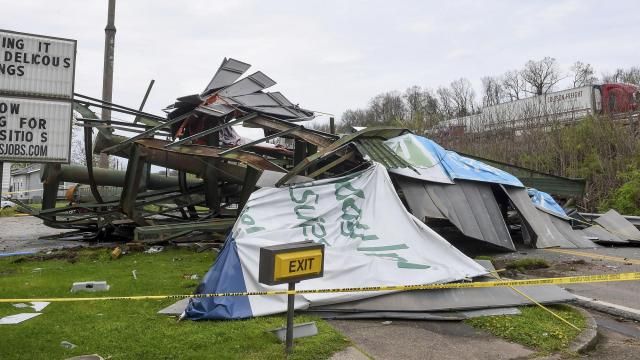 A steel billboard and its support were blown over in Dunbar, W.Va., Tuesday, April 2, 2024, after severe storms blew through the area. (Chris Dorst/Charleston Gazette-Mail via AP) A steel billboard and its support were blown over in Dunbar, W.Va., Tuesday, April 2, 2024, after severe storms blew through the area. (Chris Dorst/Charleston Gazette-Mail via AP)