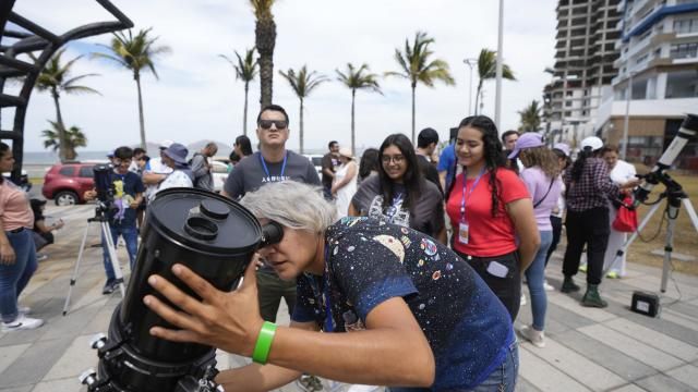 An amateur antronomer prepares her telescophe a day before a total solar eclipse in Mazatlan, Mexico, Sunday, April 7, 2024. (AP Photo/Fernando Llano) An amateur antronomer prepares her telescophe a day before a total solar eclipse in Mazatlan, Mexico, Sunday, April 7, 2024. (AP Photo/Fernando Llano)