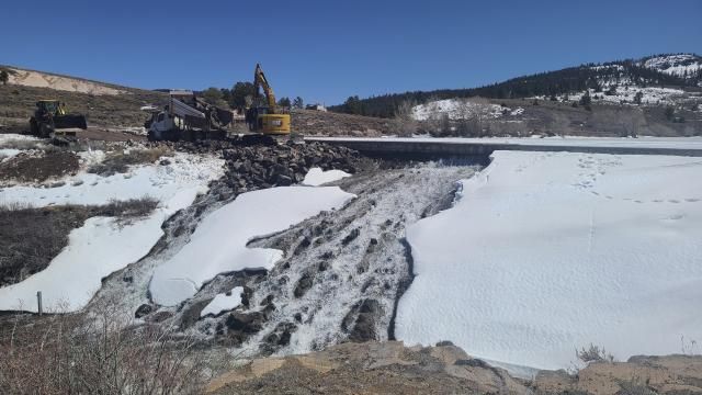 In this photo provided by the Utah Division of Water Rights, crews use heavy machinery to place boulders downstream of the cracked Panguitch Lake Dam to reinforce the wall, Wednesday, April 10, 2024, in Panguitch, Utah. (Matt Call/Utah Division of Water Rights via AP) In this photo provided by the Utah Division of Water Rights, crews use heavy machinery to place boulders downstream of the cracked Panguitch Lake Dam to reinforce the wall, Wednesday, April 10, 2024, in Panguitch, Utah. (Matt Call/Utah Division of Water Rights via AP)