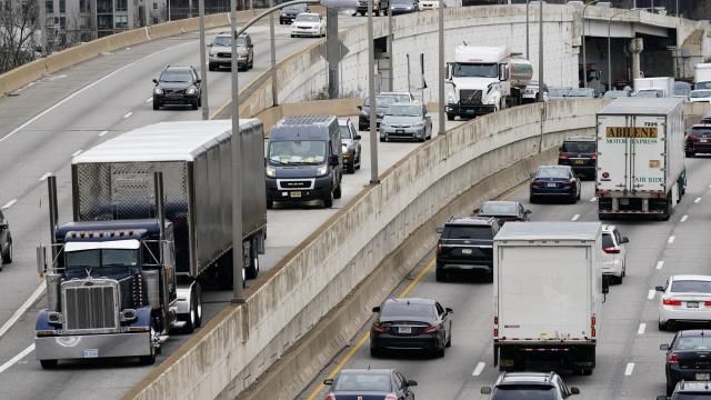 FILE - Motor vehicle traffic moves along the Interstate 76 highway in Philadelphia, March 31, 2021. Dozens of Republican attorneys general on Monday, May 13, 2024, took legal action against the Biden Administration and California over new emissions limits for trucks. (AP Photo/Matt Rourke, File)