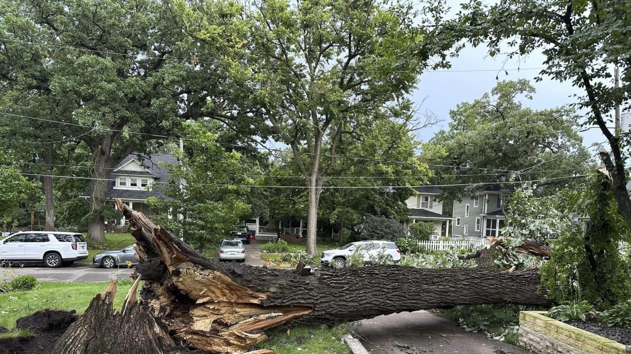 A dam fails after rain, wind, tornadoes pound the Midwest. The Chicago area  is cleaning up