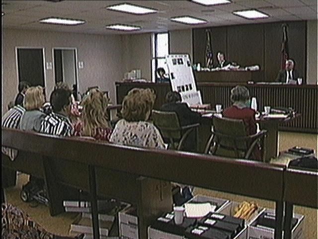 Minister Takes Stand in Harassment Trial