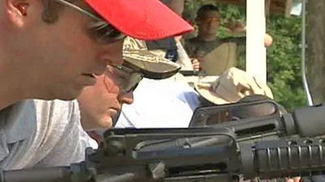 Rifles Lengthen Arm of Law in Garner